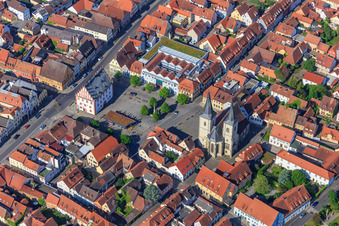 Parish Church of St. Kilian and Old Town Hall Haßfurt on the market square with market fountain in Haßfurt in the state Bavaria, Germany