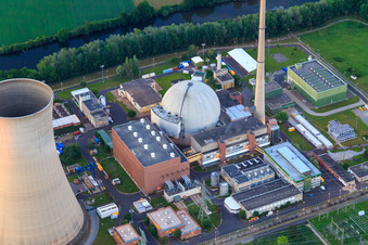 Aerial view of Cooling towers and reactor dome of the nuclear power plant Grafenrheinfeld of Preussenelektra GmbH at sunset in Grafenrheinfeld in the state Bavaria, Germany
