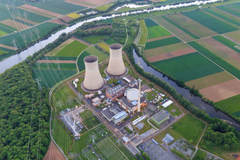 Overview of the nuclear power plant Grafenrheinfeld of Preussenelektra GmbH on the banks of the Main at sunset in Grafenrheinfeld in the state Bavaria, Germany from above