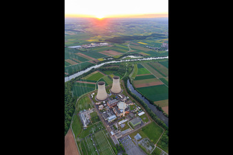 Cooling towers and reactor dome of the nuclear power plant Grafenrheinfeld of Preussenelektra GmbH at sunset in Grafenrheinfeld in the state Bavaria, Germany from above