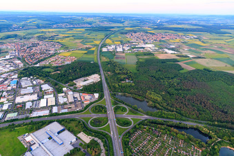 Aerial view of Motorway cloverleaf of the Schweinfurt-Zentrum junction from the A70 to the B285 with parking and allotment gardens at the lake in Schweinfurt in the state Bavaria, Germany