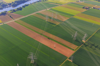 Aerial view of Cooling towers and high-voltage lines to the nuclear power plant Grafenrheinfeld of Preussenelektra GmbH on the Main river bank from the west in Grafenrheinfeld in the state Bavaria, Germany