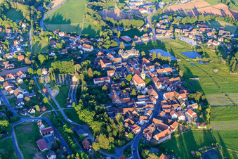 Church of St. James the Elder in the town center and castle Burgwindheim in Burgwindheim in the state Bavaria, Germany