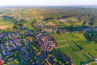 Aerial view of Village overview with Church of St. James the Elder and Castle Burgwindheim in Burgwindheim in the state Bavaria, Germany