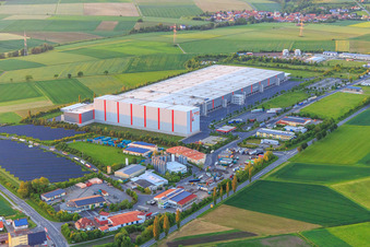 Aerial view of Industrial estate Am Rödertor with DLZ Donnersdorf- central warehouse and Kaufland Logistik VZ GmbH & Co. KG and Baumann Recycling GmbH in Donnersdorf in the state Bavaria, Germany
