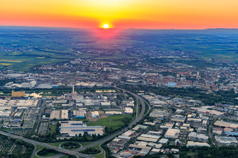 Industrial area harbor in front of the city on the Main at sunset in Schweinfurt in the state Bavaria, Germany