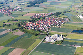Aerial view of Village - view on the edge of agricultural fields and farmland in Sulzheim in the state Bavaria, Germany