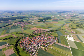 Aerial photograpy of Village - view on the edge of agricultural fields and farmland in Sulzheim in the state Bavaria, Germany