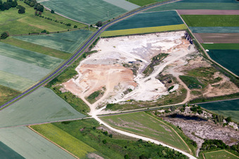 Aerial photograpy of Site and tailings area of the gravel mining of Concrete-manufacturer in Sulzheim in the state Bavaria, Germany