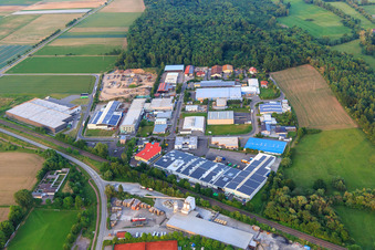 Große Ahlmühle industrial estate beyond the railway from the west in Rohrbach in the state Rhineland-Palatinate, Germany