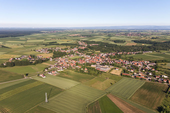 Aerial photograpy of Village - view on the edge of agricultural fields and farmland in Riedseltz in Grand Est, France