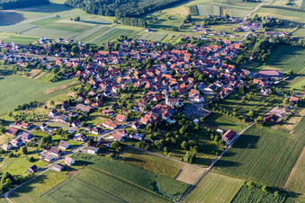 Aerial view of Village - view on the edge of agricultural fields and farmland in Schoenenbourg in Grand Est, France