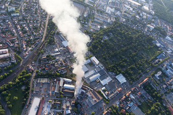 Bird's eye view of Smoke and flames during the fire fighting to fire of a storage all for antiqities in the Werkstrasse in Speyer in the state Rhineland-Palatinate, Germany
