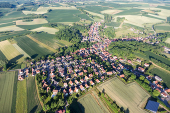 Aerial view of Village - view on the edge of agricultural fields and farmland in Neewiller-pres-Lauterbourg in Grand Est, France