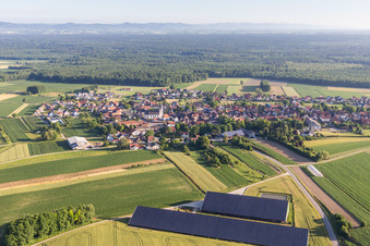 Panel rows of photovoltaic on the roofs of 2 barns in Niederlauterbach in Grand Est, France