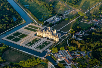 Chateau de Chambord with castle park and canal Cosson in Chambord in the state Loir et Cher, France