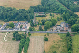 Aerial photograpy of Building and castle park systems of water castle Chateau de Combreux in Combreux in Centre-Val de Loire, France