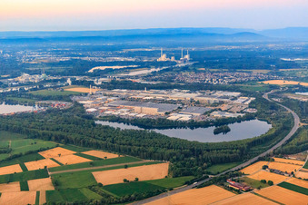 Aerial view of Overview of the Industriepark Wörth GmbH in the morning from the northwest across the lake Kiefer Rathjen with Mercedes-Benz Trucks in Wörth am Rhein in the state Rhineland-Palatinate, Germany