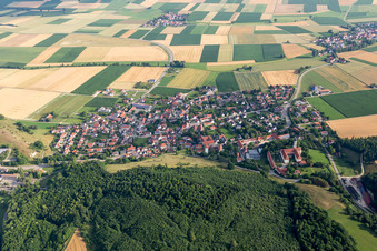 Village - view on the edge of agricultural fields and farmland in Moenchsdeggingen in the state Bavaria, Germany