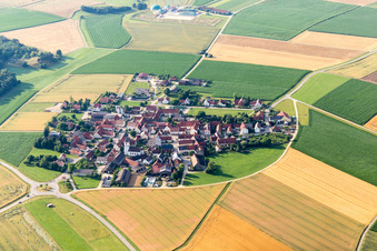 Aerial view of Village - view on the edge of agricultural fields and farmland in Moenchsdeggingen in the state Bavaria, Germany