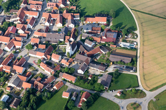 Oblique view of Village - view on the edge of agricultural fields and farmland in Moenchsdeggingen in the state Bavaria, Germany