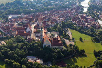 Aerial view of Complex of buildings of the monastery Heilig Kreuz in front of Ried island in Donauwoerth in the state Bavaria, Germany
