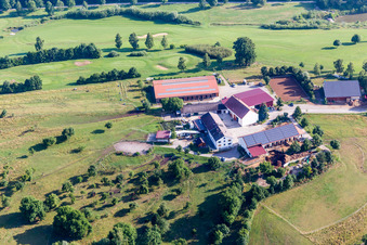 Farm near golf club on the edge of cultivated fields in the district Schiesserhof in Donauwoerth in the state Bavaria, Germany
