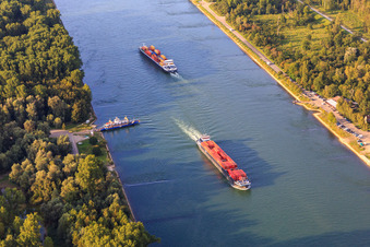 Rhine ferry Leimersheim is waiting for 2 cargo ships on the Rhine in Leimersheim in the state Rhineland-Palatinate, Germany
