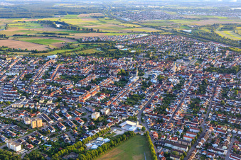 View from the northeast with volunteer fire department Hockenheim and Schmitt vegetable farm at the P1 parking lot of the Hockenheimring in Hockenheim in the state Baden-Wuerttemberg, Germany