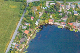 Blue Adriatic recreation area with middle path at the Swan Pond in Altrip in the state Rhineland-Palatinate, Germany