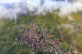 View of the winegrowing village at Keschdebusch under clouds from the east in Birkweiler in the state Rhineland-Palatinate, Germany
