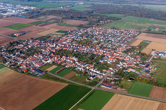 Aerial view of Village - view on the edge of agricultural fields and farmland in Ottersheim bei Landau in the state Rhineland-Palatinate, Germany