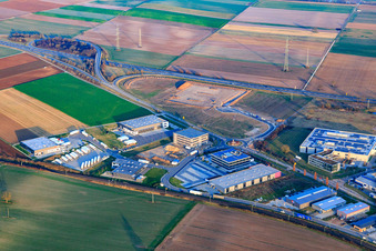 Industrial area in Speyer Valley with TRANSAC International Speditionsgesellschaft mbH, ITK Engineering GmbH, construction site of the new Kardex Software GmbH building, and Markthalle 5 in Rülzheim in the state Rhineland-Palatinate, Germany