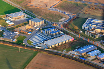 Industrial area in Speyer Valley with TRANSAC International Speditionsgesellschaft mbH, ITK Engineering GmbH, and the construction site of the new Kardex Software GmbH building in Rülzheim in the state Rhineland-Palatinate, Germany
