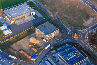 Industrial area in Speyer Valley with TRANSAC International Speditionsgesellschaft mbH and construction site of the new Kardex Software GmbH building in Rülzheim in the state Rhineland-Palatinate, Germany