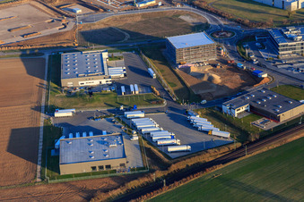 Aerial view of Industrial area in Speyer Valley with TRANSAC International Speditionsgesellschaft mbH, Markthalle 5, and the construction site of the new Kardex Software GmbH building in Rülzheim in the state Rhineland-Palatinate, Germany