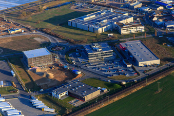 Aerial view of Industrial area in Speyer Valley with TRANSAC International Speditionsgesellschaft mbH, ITK Engineering GmbH, and the construction site of the new Kardex Software GmbH building in Rülzheim in the state Rhineland-Palatinate, Germany