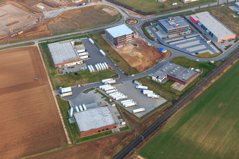Aerial photograpy of Industrial area in Speyer Valley with TRANSAC International Speditionsgesellschaft mbH, Markthalle 5, and the construction site of the new Kardex Software GmbH building in Rülzheim in the state Rhineland-Palatinate, Germany