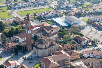 Church tower and tower roof at the church building of Chiesa delle Sante Perpetua e Felicita in Fiume Veneto in Friuli-Venezia Giulia, Italy