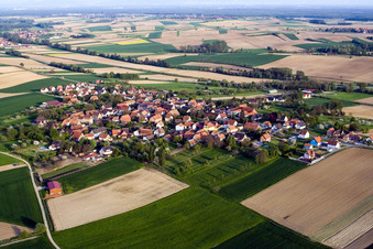 Aerial view of Village - view on the edge of agricultural fields and farmland in Hoffen in Grand Est, France