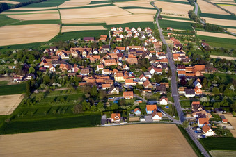 Aerial photograpy of Village - view on the edge of agricultural fields and farmland in Hoffen in Grand Est, France
