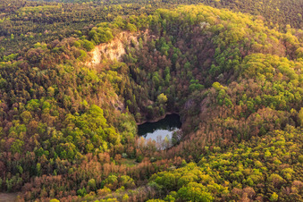 Oblique view of Basalt lake in the Pechsteinkopf nature reserve at the Old Forster basalt quarry in Forst an der Weinstraße in the state Rhineland-Palatinate, Germany