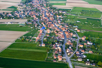 Village - view on the edge of agricultural fields and farmland in Eschbach in Grand Est, France