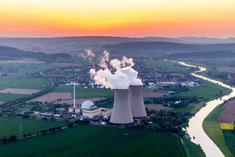 Building remains of the reactor units and facilities of the NPP nuclear power plant Grohnde on the river Weser during sunset in Grohnde in the state Lower Saxony, Germany