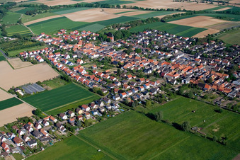 Village - view on the edge of agricultural fields and farmland in Freckenfeld in the state Rhineland-Palatinate