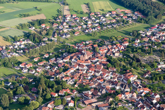 Village view on the edge of agricultural fields and land in Mudau in the state Baden-Wurttemberg, Germany