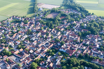 Aerial view of Agricultural land and field borders surround the settlement area of the village in Undenheim in the state Rhineland-Palatinate, Germany