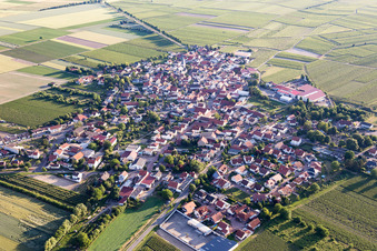 Aerial view of Agricultural land and field borders surround the settlement area of the village in Gundheim in the state Rhineland-Palatinate, Germany