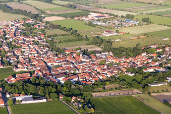Aerial view of Agricultural land and field borders surround the settlement area of the village in Dirmstein in the state Rhineland-Palatinate, Germany