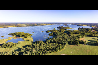 Forests on the bay of swamp coloured Asnen lake near Vrankunge in Smaland in Kronobergs laen, Sweden